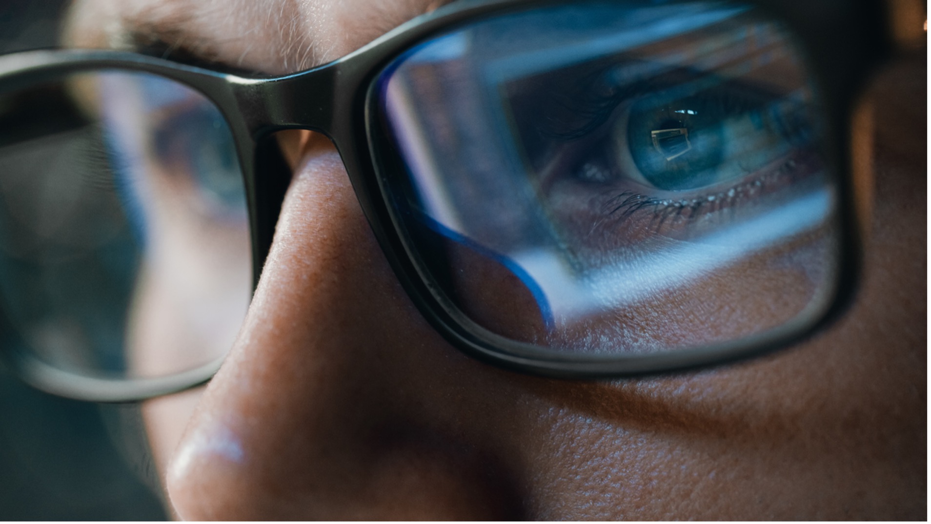 Close-up of a person wearing glasses, Protect Your Family's Eyes: How Blue Light Affects Vision and What You Can Do
