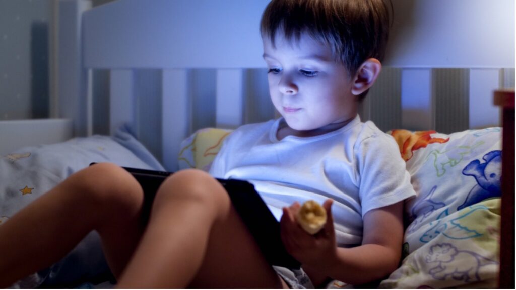 A young child playing on a tablet, Blue light and children's vision