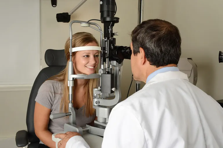 A person having her eyes examined by a doctor, Understanding the Role of Routine Eye Exams