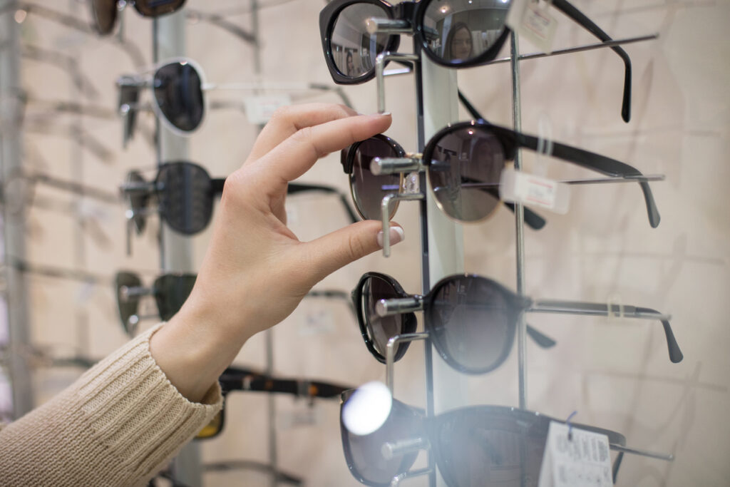 a person shopping for a pair of sunglasses, Polarized Sunglasses and Your Summer Eye Protection Guide