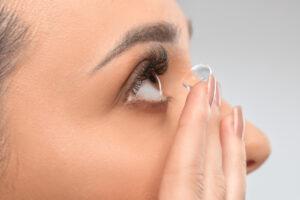 person placing contact lens into their eye, Are Contact Lenses Right for You? A Guide to Finding Your Best Vision