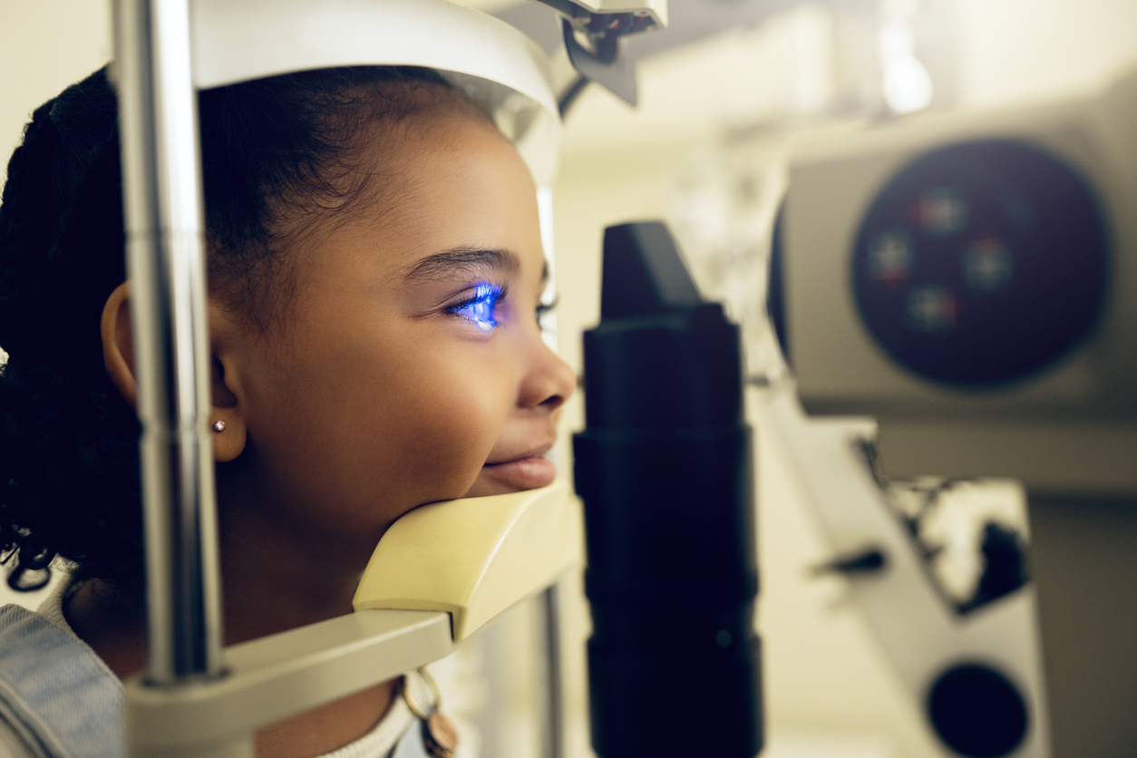 Annual Eye Exams for Children in Alice, Texas, Girl kid, face and eye exam with vision and laser machine, health and vision with optometry and wellness at clinic. Patient, LED light and scan retina for assessment with prescription and technology
