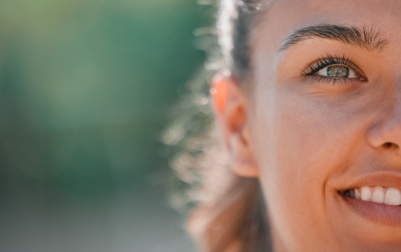 Eye-Protecting Power of Carotenoids, Eye, face and smile of woman outdoor for happiness, humanity and kindness while thinking and dreaming about future, goals or vision. Happy young girl with natural beauty while outdoor for inspiration