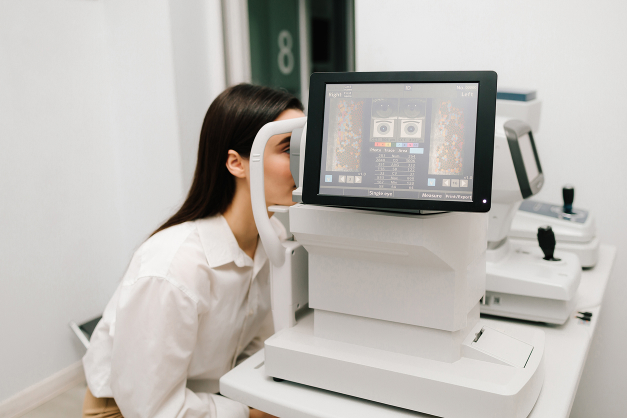 How AI Is Revolutionizing Eye Care (And Why Personal Care Still Matters More Than Ever), Patient undergoing digital retinal imaging with a modern eye care device, showing advanced diagnostic technology used in routine eye exams.